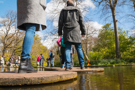 Lisse, Netherlands - April 25, 2017: People and lake in the park of flowers Keukenhofのeditorial素材