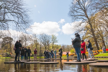 Lisse, Netherlands - April 25, 2017: People and lake in the park of flowers Keukenhofのeditorial素材