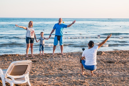 Side, Turkey - June 24, 2107: Photographer takes picture of model on the beach in the evening in Side city in Turkeyのeditorial素材