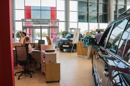 Russia, Kirov - August 21, 2017: Manager and car in showroom of dealership Toyota in Kirov city in 2016のeditorial素材