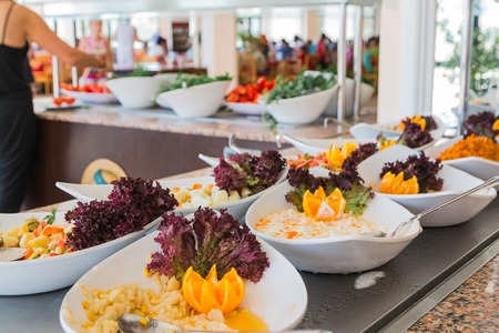 The buffet in the hotel full of different foodの写真素材