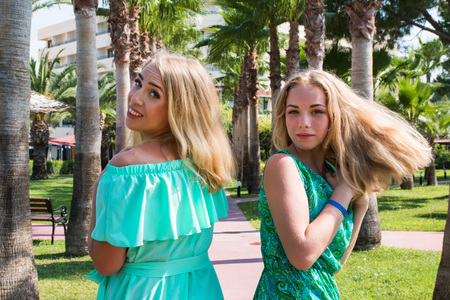 Portrait of happy mother and daughter in the park in a summer dayの写真素材