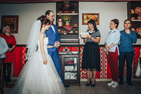 Kirov, Russia - November, 24, 2017: Guests congratulate the bride and groom in a decorated roomのeditorial素材