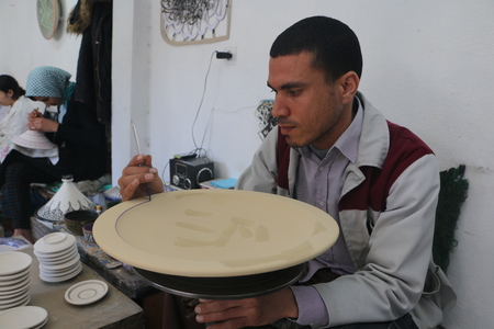 Rabat, Morocco - May 15, 2016: Master workshop draws patterns on the dishes in Rabat city in Moroccoのeditorial素材