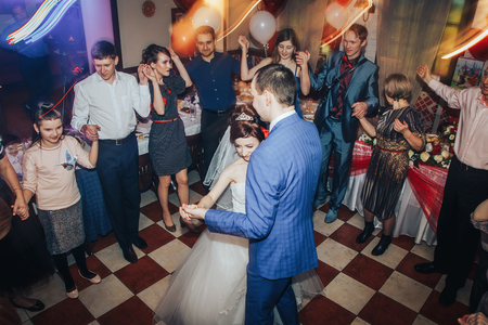 Kirov, Russia - November, 24, 2017: Bride and groom dance together with guests in a dancing hallのeditorial素材