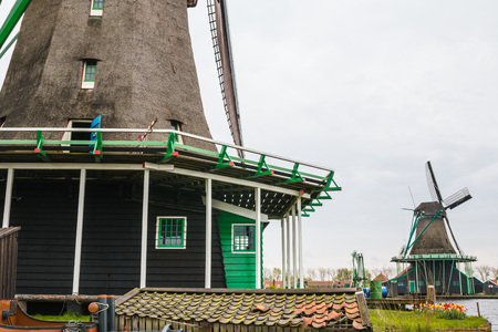 Windmill and the landscape around in a cloudy dayの写真素材