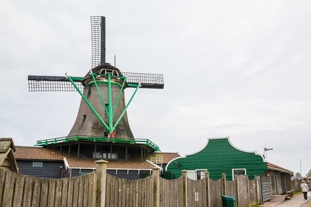 Windmill and the landscape around in a cloudy dayの写真素材