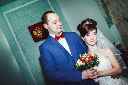 Bride and groom in the registry office during wedding ceremonyの写真素材