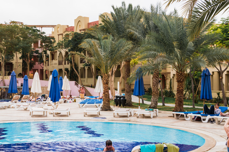 Aqaba, Jordan - December 19, 2017: Swimming pool and palm near it in hotel Marina Plaza in Aqaba in Tala bay in Jordanのeditorial素材