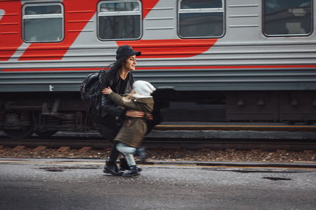 Mother and daughter at the train station in a dayの写真素材