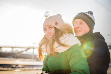 Couple at a railway station in a cold winter dayの写真素材