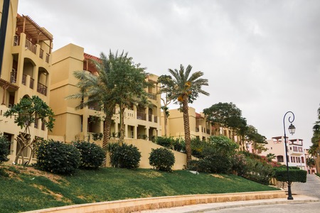 Building on a city street in a summer cloudy dayの写真素材