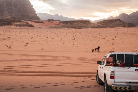 Wadi Rum, Jordan - December, 25, 2017: Car jeep and tourist family in Wadi Rum desert in Jordanのeditorial素材