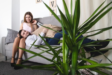 Lovely couple have fun and relax at home togetherの写真素材