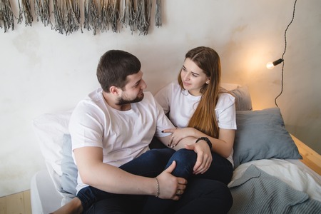 Lovely couple have fun, rest and relax on the bed in the bedroom. Lifestyle conceptの写真素材