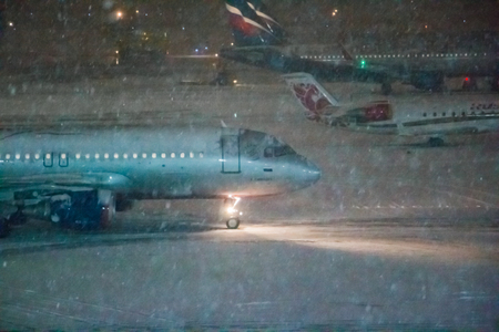 Moscow, Russia - December 19, 2017: Airplane on the runway in airport in a snowing winter day in Moscow in Russiaのeditorial素材