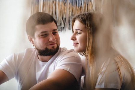 Lovely couple have fun, rest and relax on the bed in the bedroom. Lifestyle conceptの写真素材
