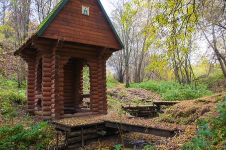 Wooden chapel near the Holy spring in the forest in a dayの写真素材