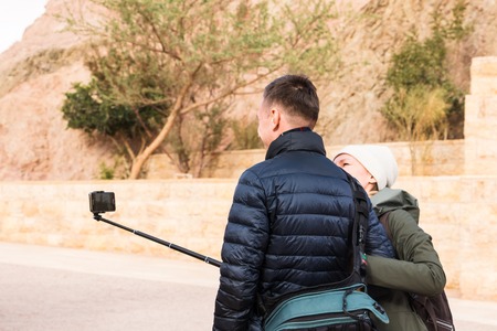 Wadi Rum, Jordan - December, 25, 2017: Tourist takes pictures in beduin's camp in Wadi Rum desert in...