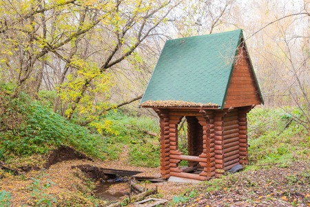 Wooden chapel near the Holy spring in the forest in a dayの写真素材