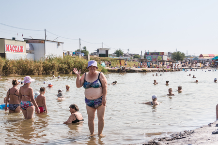 Russia, Sol-Iletsk - August 03, 2016: Salt Lake in Sol-Iletsk, water, beach and people there. Summer sunny dayのeditorial素材