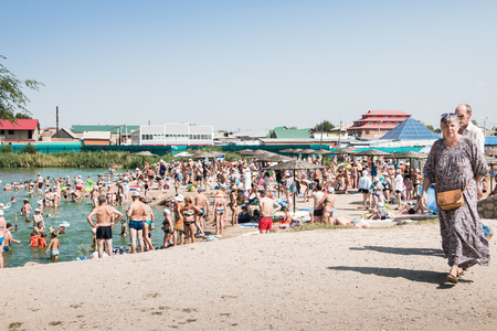 Russia, Sol-Iletsk - August 03, 2016: Salt Lake in Sol-Iletsk, water, beach and people there. Summer sunny dayのeditorial素材