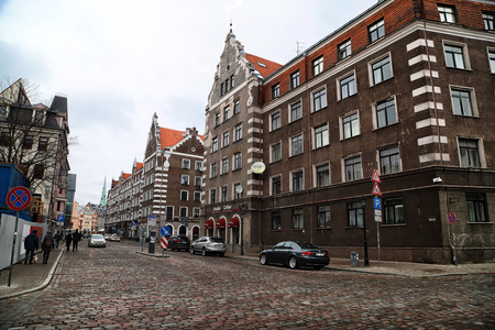 RIGA , LATVIA - April 01, 2018: Building on the street of old part of Riga city in cloudy spring day