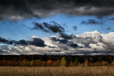 landscape and dramatic sky with grey cloudsの写真素材