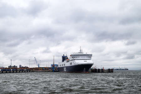 Klaipeda, Latvia - April 02, 2018: Big ferry in port in Klaipeda in Latvia in cloudy day
