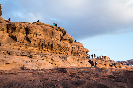 Wadi Rum, Jordan - December, 25, 2017: Tourists in the dunes in Wadi Rum desert in Jordanのeditorial素材