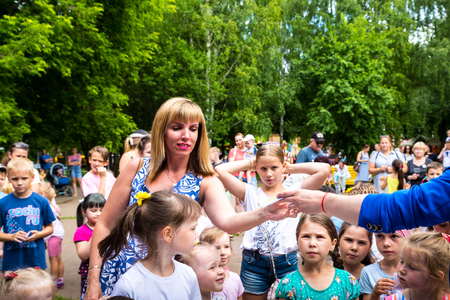 Kirov, Russia - July 08, 2018: Parents and children are waiting for the lottery in the Park Multiland in Kirov cityのeditorial素材