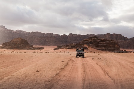 Wadi Rum, Jordan - December, 25, 2017: Bedouin's car jeeps and tourists in it in Wadi Rum desert in Jordanのeditorial素材