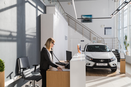 Kirov, Russia - March 06, 2018: Cars and manager in showroom of dealership AVTOVAZ named SeverAvto in Kirov city in 2018. Top viewのeditorial素材