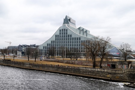 RIGA , LATVIA - April 01, 2018: Modern building in Riga city in cloudy spring dayのeditorial素材