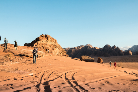 Wadi Rum, Jordan - December, 25, 2017: Tourists in the dunes in Wadi Rum desert in Jordanのeditorial素材
