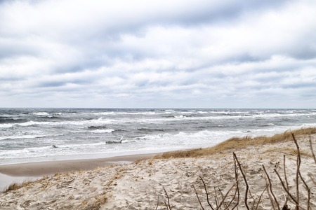 Sea and beach views from the sand dunes of the Curonian spit in a cloudy day. Nida in Lithuania and...