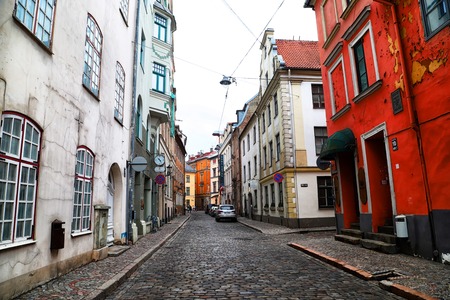 RIGA , LATVIA - April 01, 2018: Street and houses on it in old part of Riga city in cloudy spring dayのeditorial素材