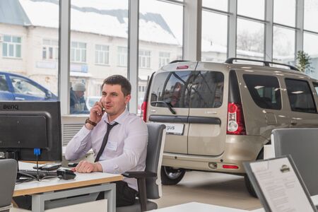 Kirov, Russia - March 06, 2018: Manager in showroom of dealership russian car plant AVTOVAZ named SeverAvto in Kirov city in 2018のeditorial素材