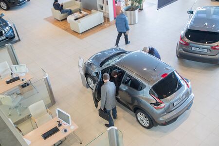 Kirov, Russia - March 14, 2018: Customer and cars in showroom of dealership Nissan in Nizhny Novgorodcity in 2018のeditorial素材