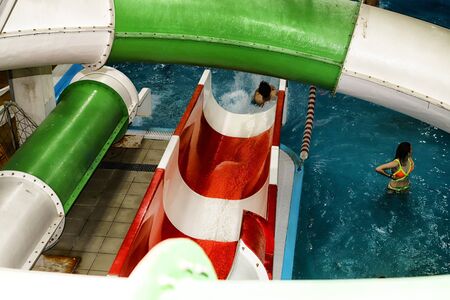 Kirov, Russia - August 19, 2018: Teenagers and slides on party AQUA MADFLOW at Russia in Kirov city...