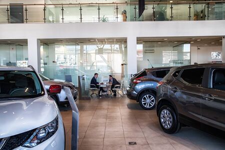 Kirov, Russia - March 14, 2018: Manager in showroom of dealership Nissan in Nizhny Novgorodcity in 2018のeditorial素材
