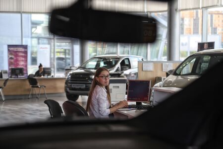 Kazan, Russia - May 27, 2018: Manager and car in showroom of dealership Ford in Kazan in 2018のeditorial素材
