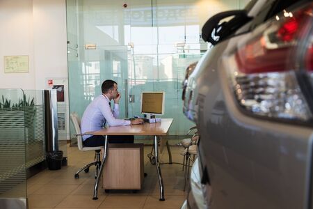 Kirov, Russia - March 14, 2018: Car and manager in showroom of dealership Nissan in Nizhny Novgorodcity in 2018のeditorial素材