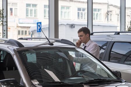 Kirov, Russia - March 06, 2018: Manager in showroom of dealership russian car plant AVTOVAZ named...