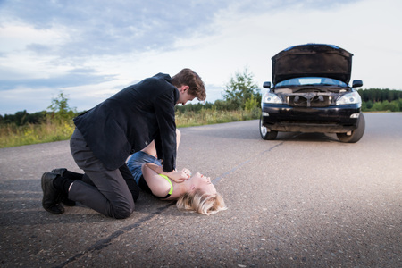 Man strangling a girl on the road for a broken car. Photoshootの写真素材