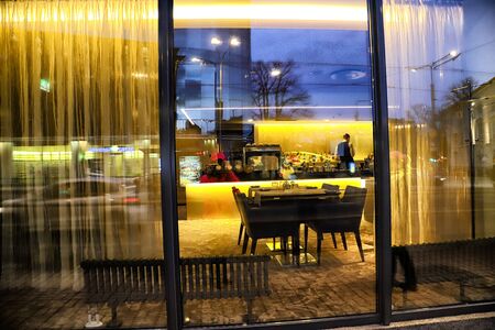 Tallinn, Estonia - March 30, 2018: Bar counter in empty comfortable restaurant at nightのeditorial素材