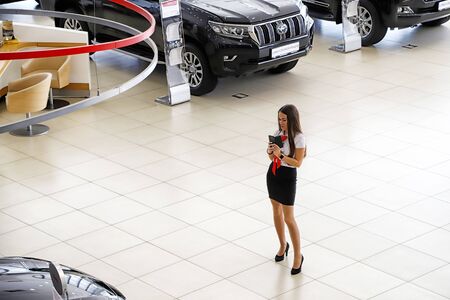Kazan, Russia - August 31, 2018: Manager in car showroom of dealership Toyota in Kazan city