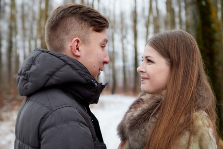 Romantic couple in love on autumn or winter walk
