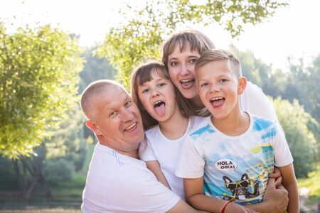 Kirov, Russia - August 21, 2018: Happy family in the Park. Mom, dad, son and daughter during a walk in the summer dayのeditorial素材