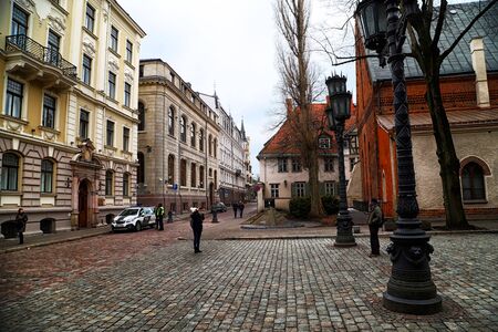 RIGA , LATVIA - April 01, 2018: Street and houses on it in old part of Riga city in cloudy spring dayのeditorial素材
